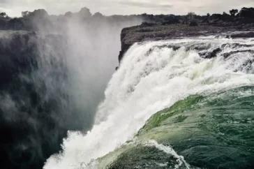 Laying on the Edge of Victoria Falls