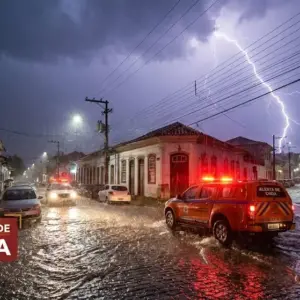 Ilustração de tempestade severa e alagamento em cidade do interior, representando o alerta vermelho no Espírito Santo.