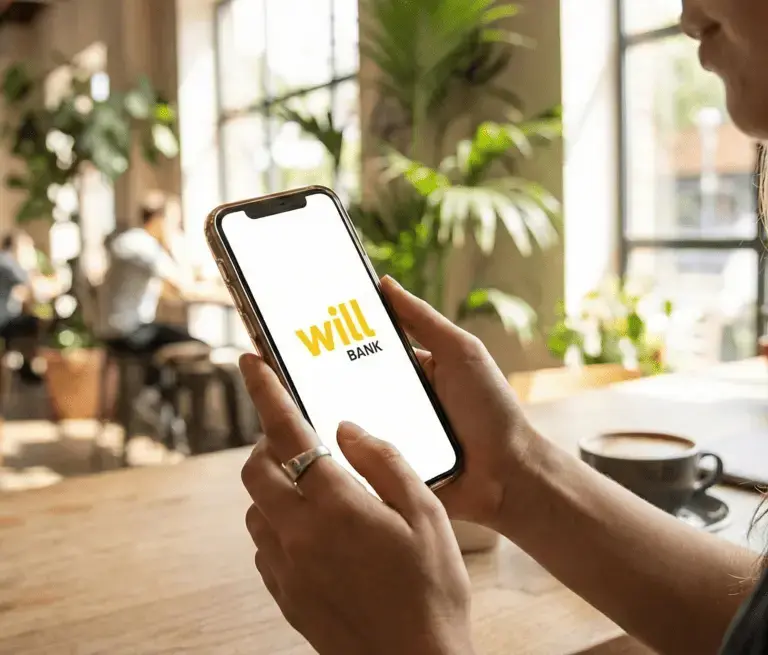 Smartphone exibindo aplicativo do Will Bank bloqueado após decreto de liquidação pelo Banco Central
